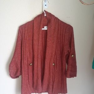 A orange cato sweater.